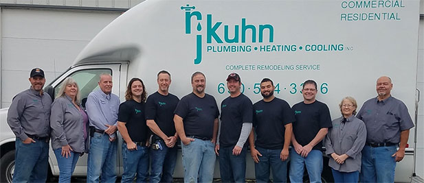 RJ Kuhn team posing in front of company truck